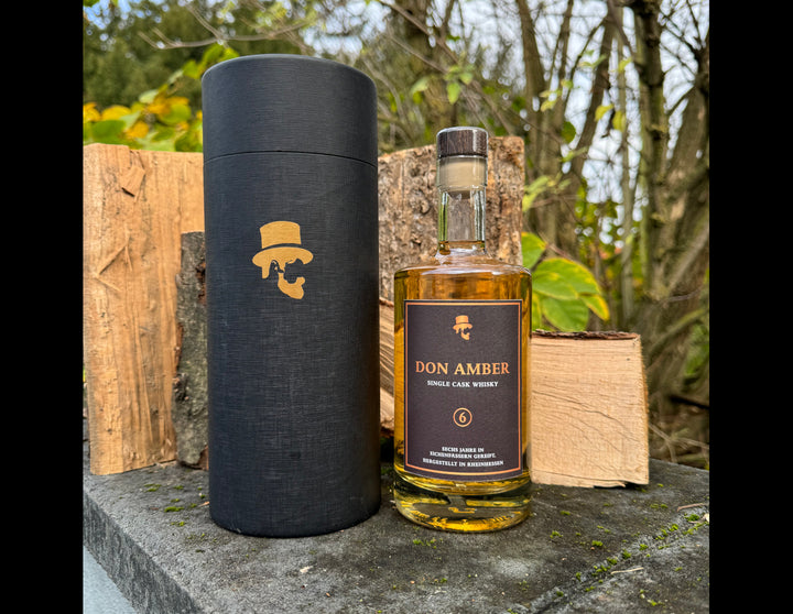 Don Amber Whisky neben der Don Drinks Premium Verpackung