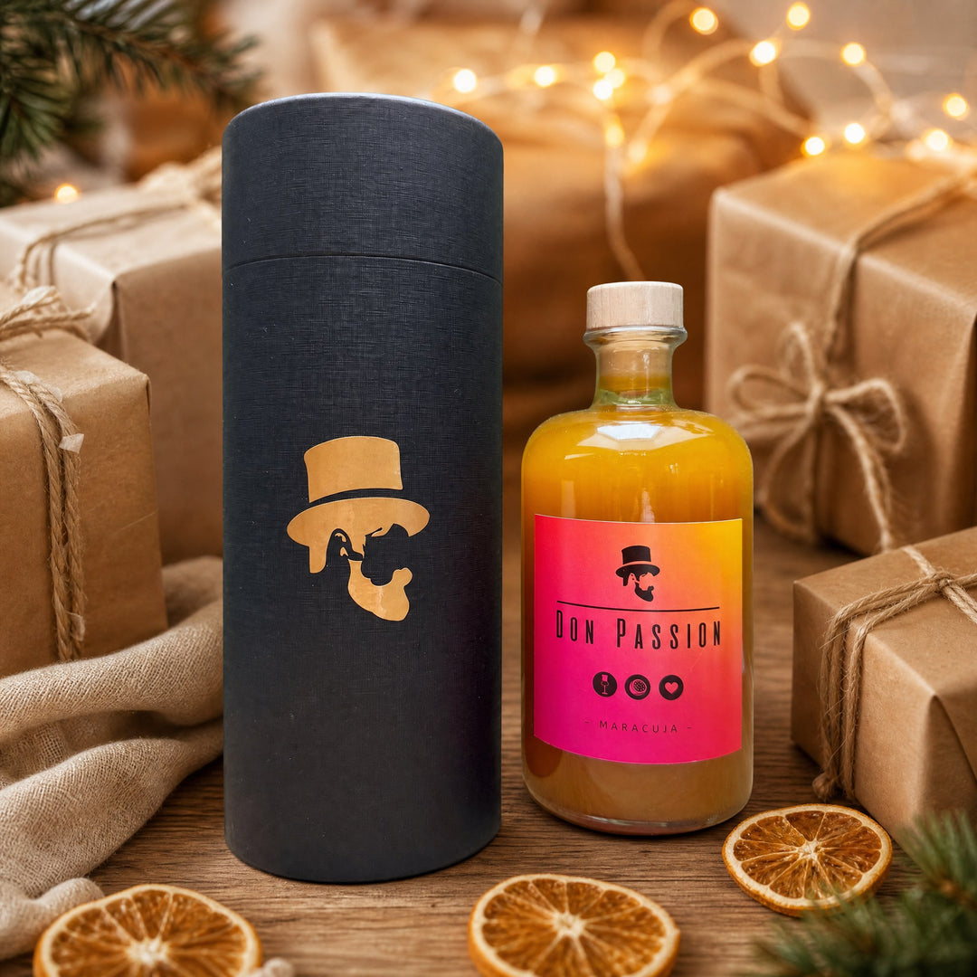 Don Passion mit schwarzer Premium-Geschenkdose zwischen Geschenken